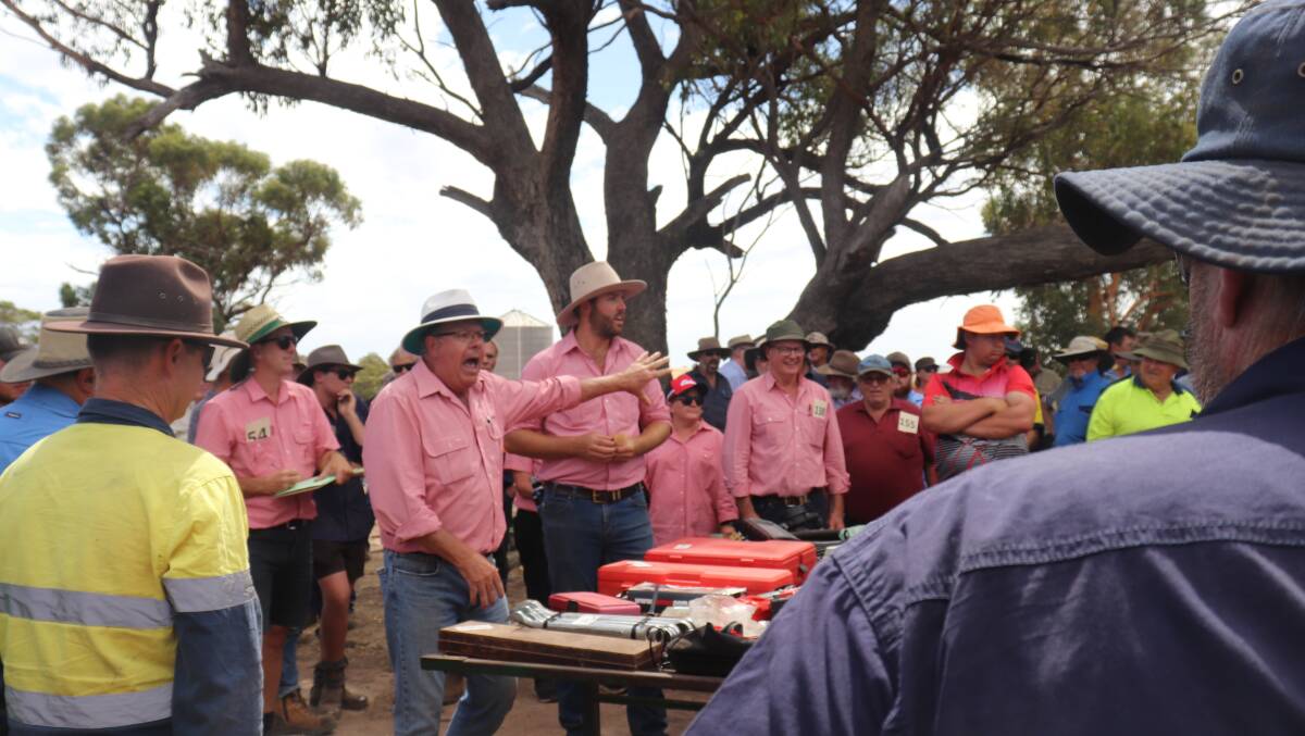Elders used three auctioneers at the clearing sale to get through 272 lots in hot conditions ahead of possible thunderstorms which ultimately provided just a brief sprinkle of rain. Here Graeme Curry auctions hand tools.