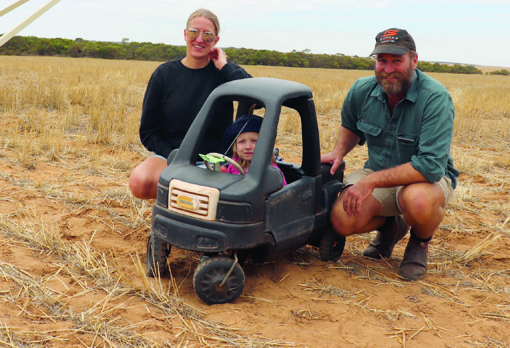 Eneabba farmers Caroline and Callum Scott were trying to keep up with their daughter Amaia at the Nutrien Ag Solutions clearing sale at Three Springs last week. The 3 year old was quick to notice the quad bike and the toy vehicle  which was included in the machinery section of the sale for a laugh.