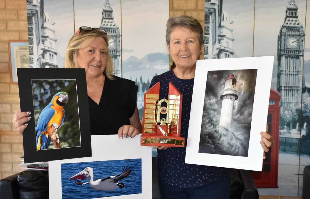 Photography section head steward Glenys Ball (left) and Wagin Camera Club representative Coral Davies display some of the entries for this year's Woolorama.
