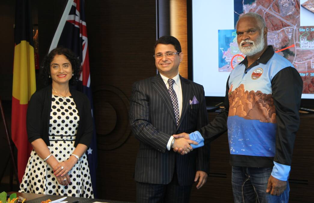An historic signing clears the way for a granulated urea fertiliser project on the Burrup Peninsula, near Karratha. At the signing were Perdaman Global Services chief executive officer Meagha Rambal (left), Perdaman chairman Vikas Rambal and Murujuga Aboriginal Corporation chief executive officer Peter Jeffries.