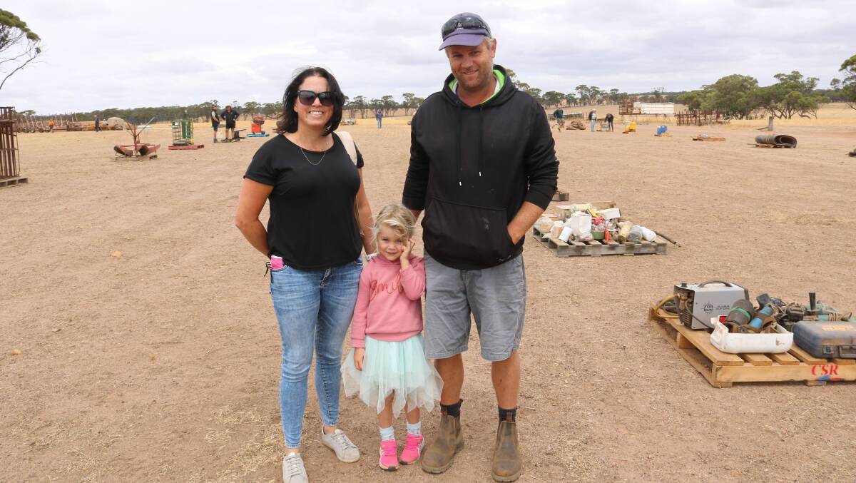 Katrina (left), Mikayla, 3, and Adam Gray, Harrismith, attended the Thomson clearing sale at Tincurrin.