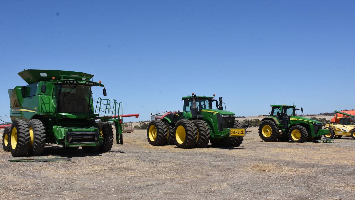 These three John Deere items all made six figure values. The 2014 John Deere S680 header with with 2014 John Deere 640D Draper front (left) sold for a $100,000, the 2020 John Deere 9520R four-wheel drive tractor made the days $510,000 top price and the 2021 John Deere 8R340 tractor sold for $370,000.
