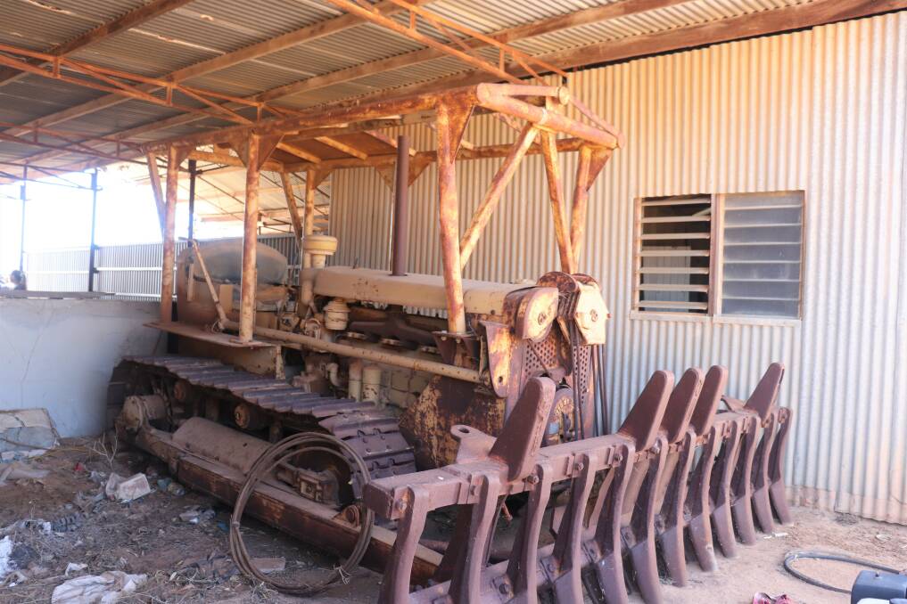 The late 1940s early 1950s Caterpillar D68U with winch and cable-raised bull rake and blade failed to attract a bid.