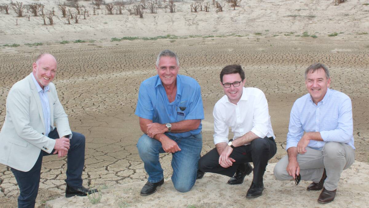 The Nationals WA agriculture spokesman Colin de Grussa (left), Ravensthorpe farmer Andy Chambers, Federal Agriculture Minister David Littleproud and Member for Roe Peter Rundle in front of a dry dam on a property to the north of Ravensthorpe.