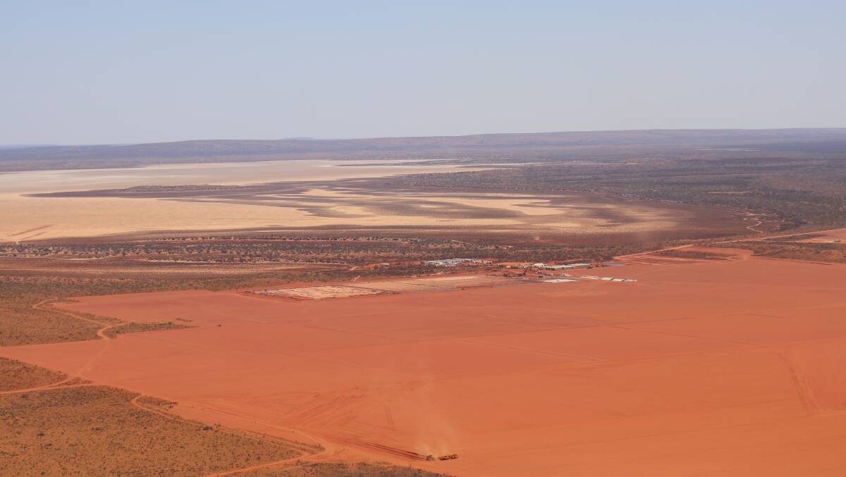 Kalium Lakes Ltd's Beyondie Sulphate of Potash (SoP) fertiliser project in the Little Sandy Desert last October. The work camp is in the centre of the picture with the flattened area in the foreground to be lined evaporation ponds. In the background is one of a chain of salt lakes that will provide hypersaline brine to be converted into low-salt premium SoP fertiliser.