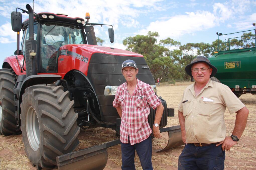 In front of a Case IH 340 Magnum tractor were Ray Witt (left), Three Springs and John Tropiano, Mullewa. The tractor was initially passed-in on a bid of $194,000 but an after-sale negotiation saw it sold for $205,000, to top the sale.