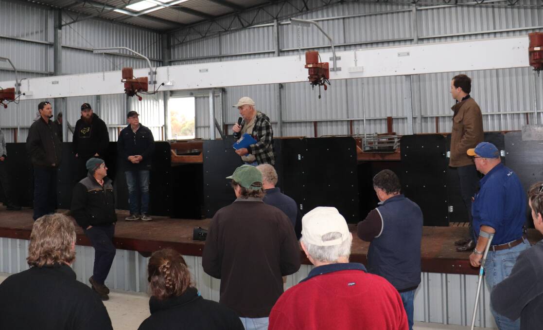 Don Boyle addressed the attendees at each of the five sheds on the tour to point out the details which make the job of the shearing teams easier.