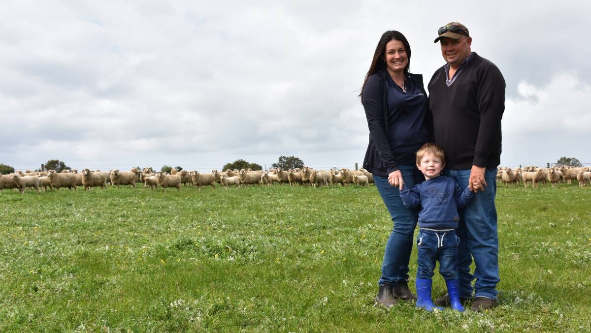 Jess and Brad Alp with their son Scott, three, and some of their mixed age first cross Border Leicester ewes with their Poll Dorset cross lambs at the family's farm in Beermullah.