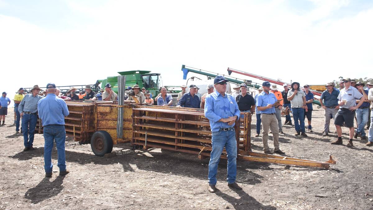 Westcoast Wool & Livestock auctioneer Chris Hartley taking bids on the set of McDougall portable sheep yards that made $9000.