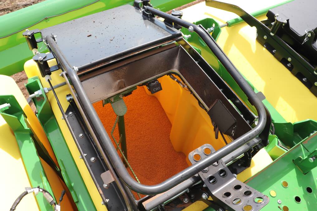 The view inside the plastic box on the aircart with fertiliser inside. It shows the large handle and catch as well as the sensor and LED lights attached to the edge of the rim for level monitoring. Mr Young said opening the hatch was easy and when closed it acted as a hand rail for improved safety.