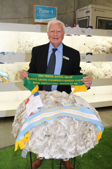 RASWA steward in charge of wool Ken Walker, Perth, with WA College of Agriculture, Cunderdins, reserve grand champion farmers fleece, also the reserve grand champion farmers ewe or wether fleece.