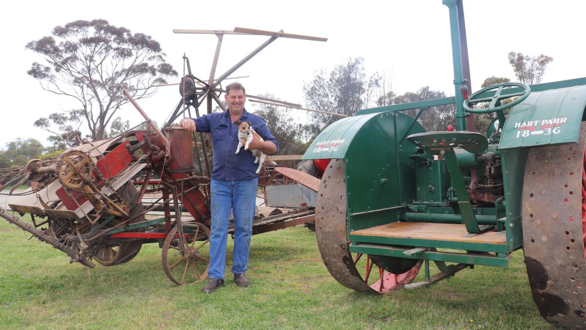 Peter Spurr, with dog Ricky in front of a 1920s ground-driven Sunshine hay binder and with a 1927 Harts Parr tractor from his extensive collection in the foreground, will host a vintage hay making day open to the public on his Wagin property.