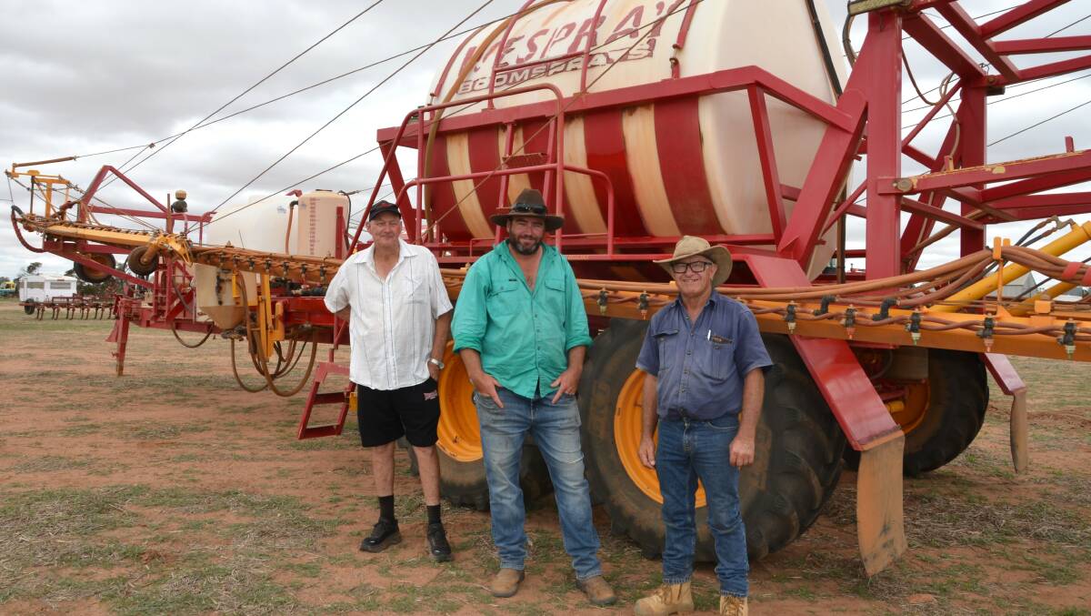 Willy Van Deleer (left), Seb Jenkin and Phil Smith, all from Mukinbudin, with a tandem trailed 2009 Wespray 10,000 litre 36.5 metre boomsprayer with twin lines, offered by outside vendor Trevor Watson, Webray Pastoral, Bonnie Rock. It was passed in at $20,000 but sold privately later.