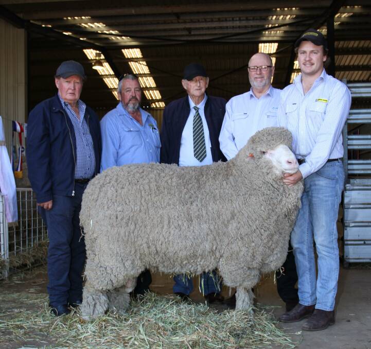 The Lewis family, Lewisdale stud, Wickepin, sold the second top-priced Merino/Poll Merino ram and the top-priced ram at a single vendor sale when it sold a half semen share in this four-tooth sire for $21,000 at its annual on-property ram sale at Wickepin. With the ram were Lewisdale stud principal Ray Lewis (left), buyer Andrew Kitto, Dyson Jones, Lewisdale stud representative of 53 years John Sherlock, AWN auctioneer Don Morgan and Sam Howie, Dyson Jones.