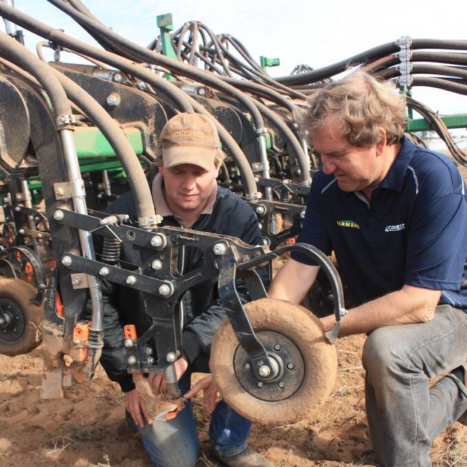 Jennacubbine farmers Dylan West (left) and his father Darren discuss the performance of the paired row boot which was a specific addition to the DBS because the majority of the Wests program is growing oats for export hay.