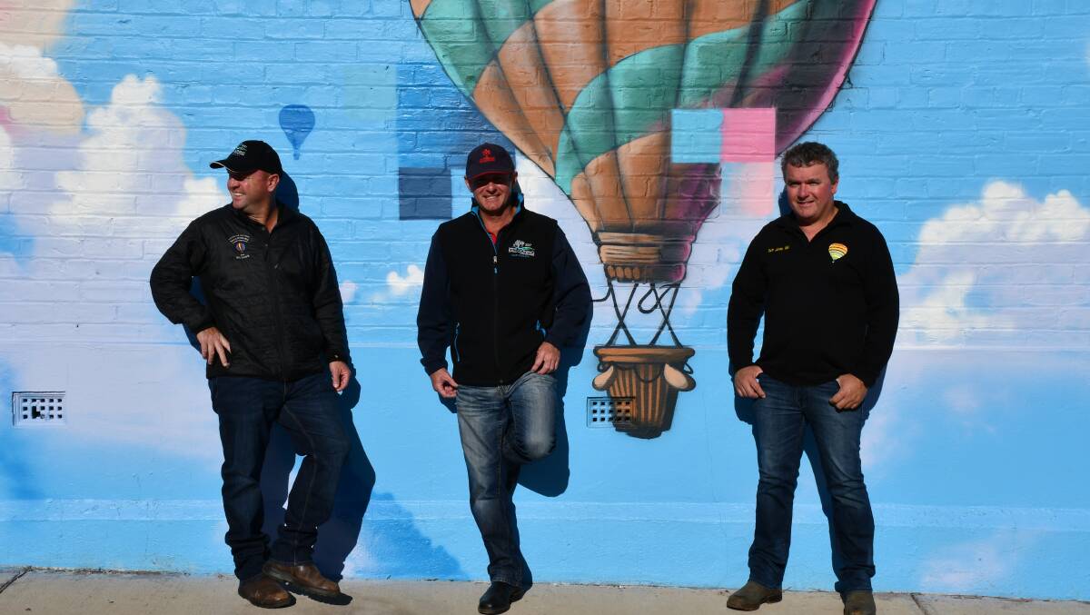 Northam brothers and hot air balloon pilots Peter (left), Michael and Andrew Clements in front of a mural created by artist Jackson Harvey to acknowledge Northam's hot air ballooning heritage. The brothers will compete in the 2021 National Ballooning Championships in Northam in late August.
