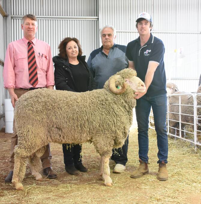 The top price in the Merino offering was $6000 for this sire paid by Cramphorne Farms, Muntadgin. With the ram were Elders Wickepin/Pingelly representative Jeff Brown (left), buyers Leah and Ashley Starcevich and Kolindale co-principal Luke Ledwith.