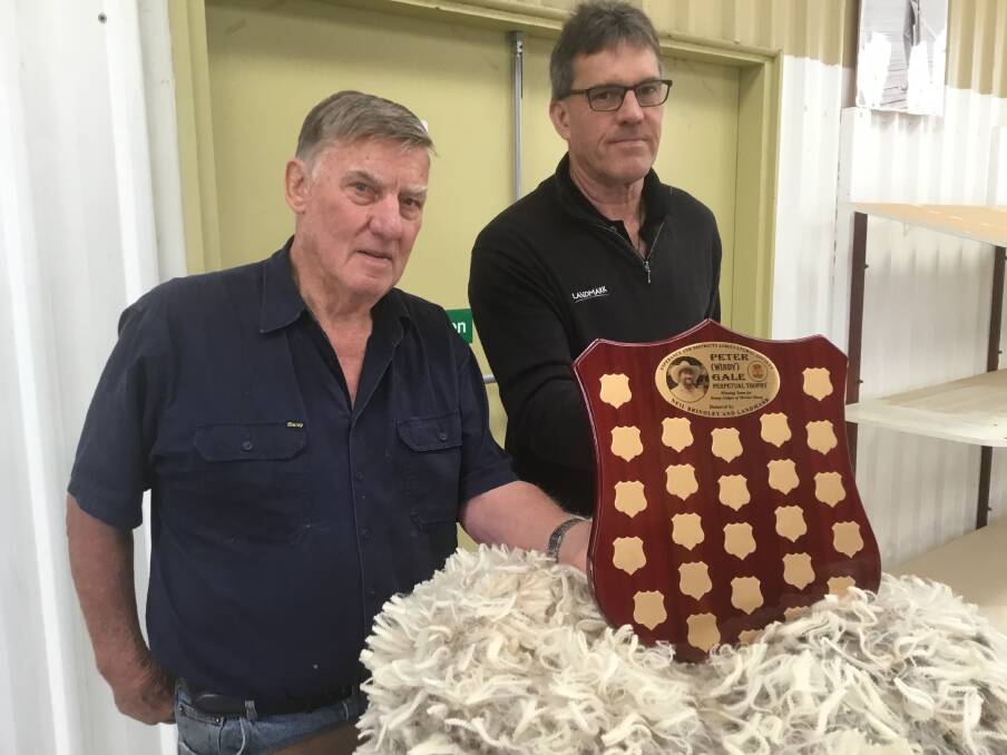 Graham Cooper (left), Esperance and Districts Agricultural Society president and Andrew Beaton, account manager wool, Landmark Esperance and chief steward for the wool section at the Esperance at District Agricultural Show with the Peter 'Windy' Gale perpetual trophy.