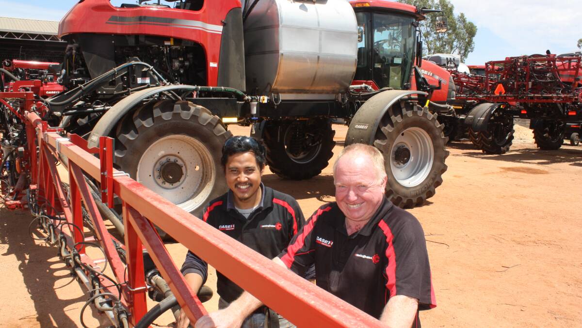  RedMac Moora heavy duty mechanic Brian Albinda (left) and branch manager Rob Brandis oversee the pre-delivery of this Case IH 4430 self-propelled boomsprayer.