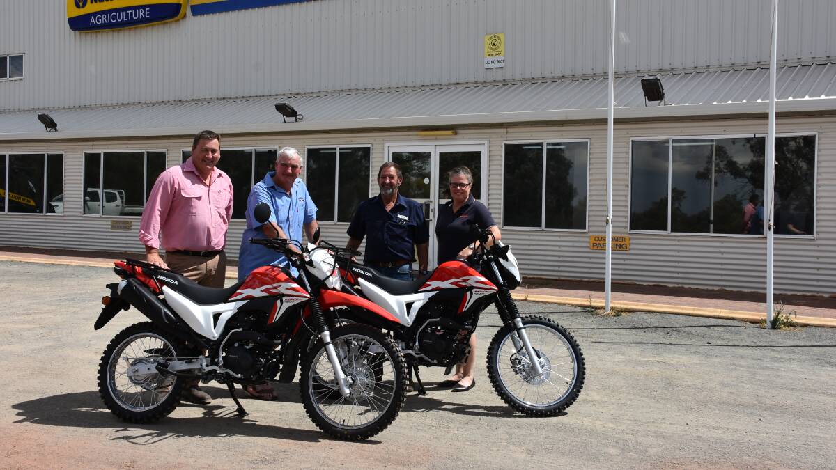 Elders and Farm Weekly will now provide two Honda XR190L AG two-wheeled agricultural motorbikes as part of their overall sponsorship package at this year's Make Smoking History Wagin Woolorama. With the two bikes are Elders stud stock manager Tim Spicer (left), Woolorama president Howie Ward, Geoff Perkins Farm Machinery Centre principal Geoff Perkins and Farm Weekly livestock manager Jodie Rintoul.
