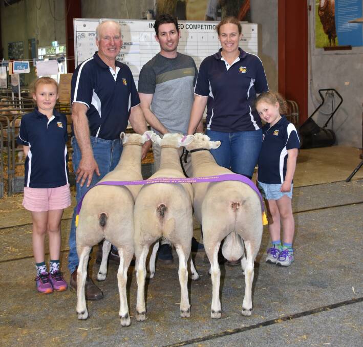 The grand champion interbreed breeder's group for one ram and two ewes was exhibited by the JimJan Texel stud, Boyup Brook. Holding the winning group was stud co-principal Jim Glover (left), with son-in-law Jamie Robertson and daughter Kristy. With them were Ella and Josie Robertson.