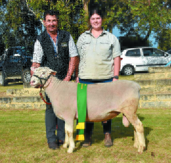 Kohat stud principal Greg Hyde, Ongerup and daughter Chloe with the stud's reserve British, Australasian and other breeds supreme champion ram.