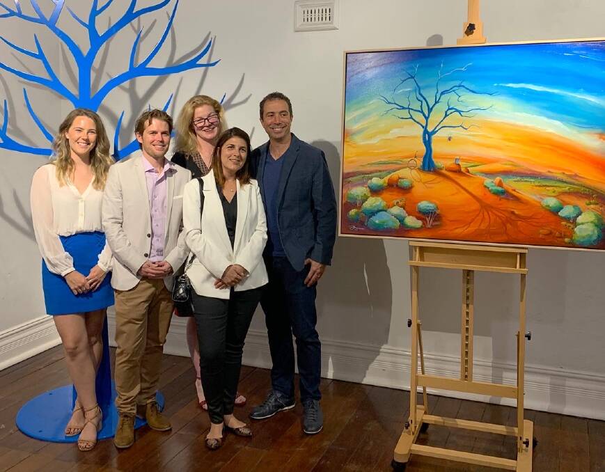 Blue Tree Project founder Kendall Whyte (left), artist Peter Ryan, Bailiwick Legal's Jess Brunner (back row) with buyers Renata and Wilson Casado who bought the exhibition's hero piece for $9000.