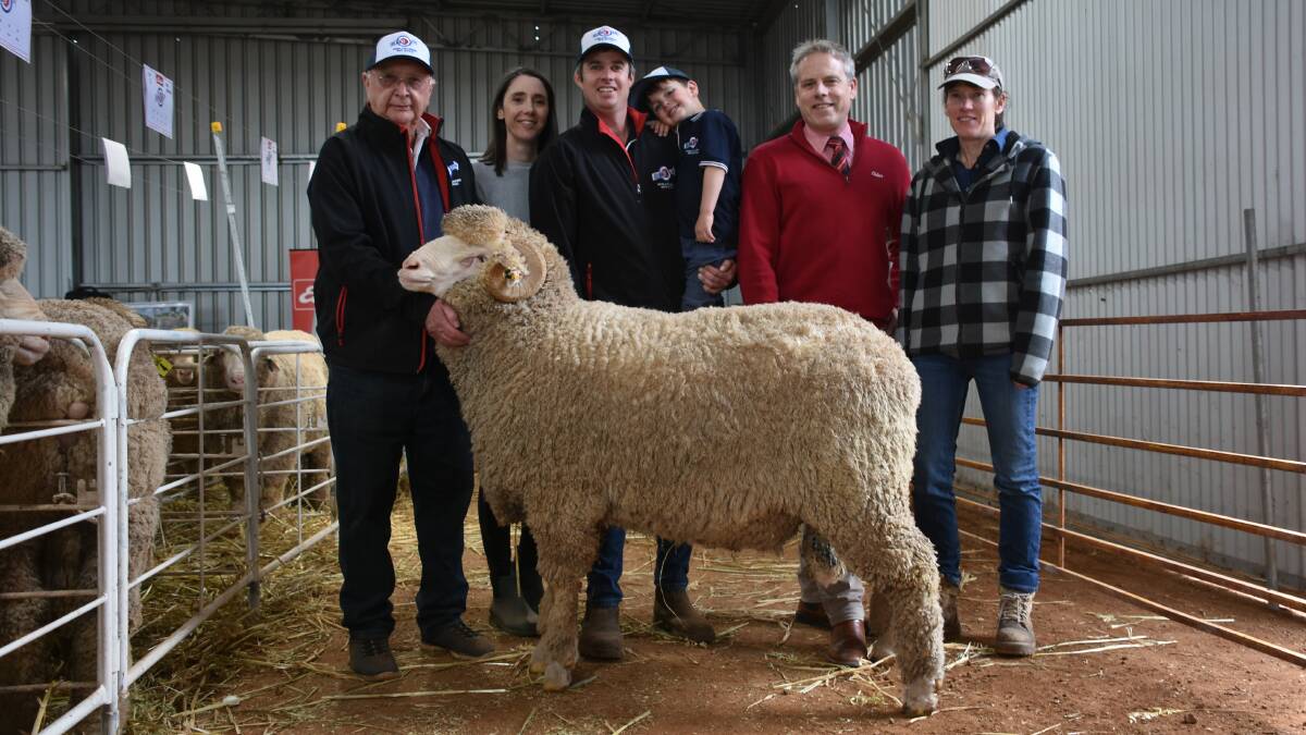 With the $9000 top-priced Merino ram at the Kolindale on-property ram sale at Dudinin on Monday were Kolindale connection Colin Lewis (left), Kolindale co-principals Daniela Varone and Luke Ledwith with son Louis, Elders central area manager Matt Beckett and buyer Linda McCrea, Salmon Gums.