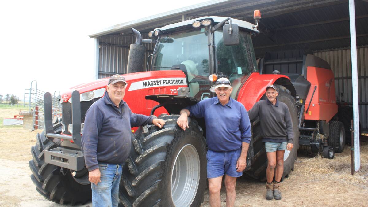 Joe (left), Peter and Tony Italiano with their new Massey Ferguson 7614 Dyna-4 tractor.