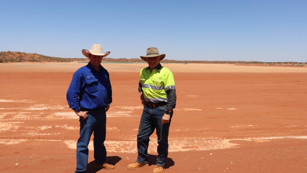 Kalium Lakes' major private shareholder Brent Smoothy (left) and chairman Mal Randall standing in the Sunshine Lake pre-concentrator pond before it is lined with plastic sheeting as part of the Beyondie Sulphate of Potash project in the Pilbara.
