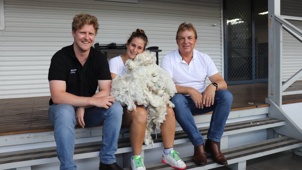 Nutrien Ag Solution's Rohan Gaunt (left), Fremantle Wool Trader's wool valuer Martina Delorenzi with a sample of the 14.4 micron Superfine fleece she identified in the Nutrien wool catalogue as the finest available in Australia that week and Fremantle Wool Trading director John Bradbury who said the wool would go to Italy to be processed into the "best of the best" yarn.