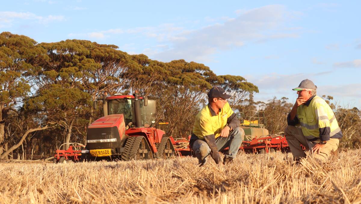 Katanning farmer Norm Flugge (right), inspects a freshly seeded paddock with farm employee Michael ODonnell. Mr Flugge said they were about 600 hectares off finishing their 4000ha cropping program.