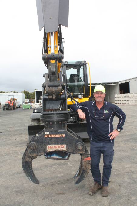 Jasper Farms employee Scotty Maitland operates the JCB Hydradig pruning avocado trees and has given it the thumbs-up after four weeks of operation.