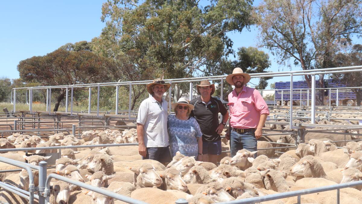 Vendors Don and Sue Pegrum, Rockwell Farms, Kondinin, buyer Andrew James, Kalgarin and Elders auctioneer Steele Hathway with one of the Rockwell Farms Dohne July shorn, Chirniminup blood ewe genuine flock dispersal lines that sold at Corrigin.