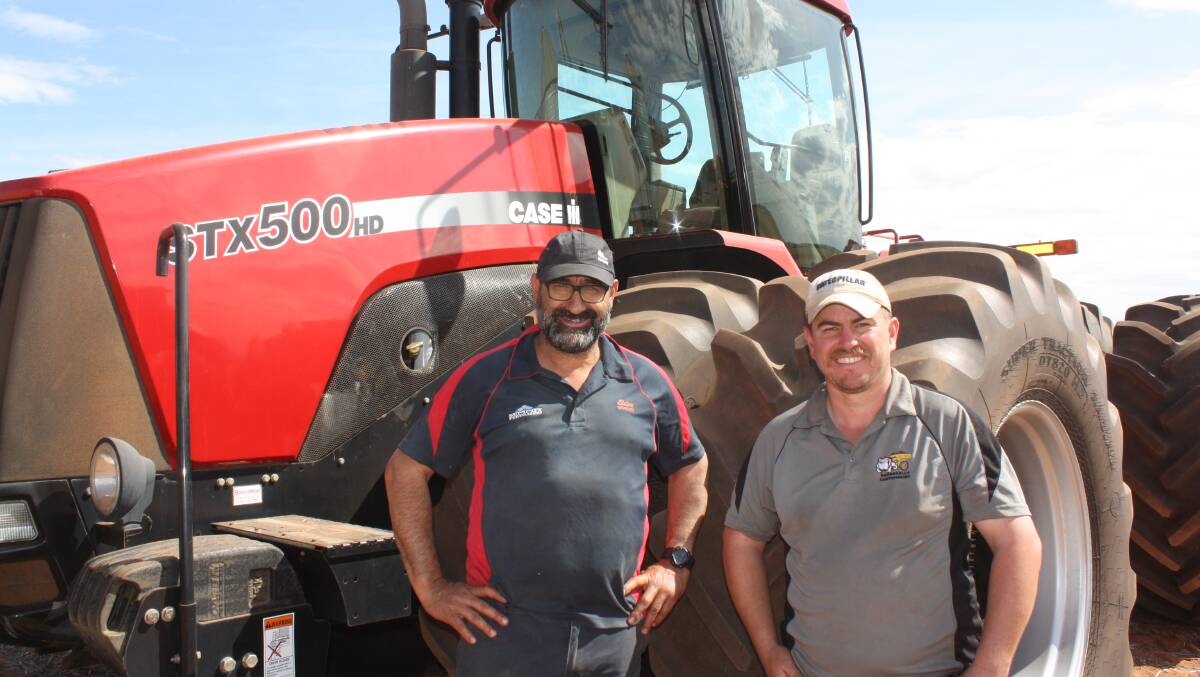 Looking over a Case IH STX500 Steiger tractor were Merredin farmers Joe (left) and Jason Alvaro. It was passed-in at $107,000 but was later sold to TM & AM Grant, Beacon, for $113,000.