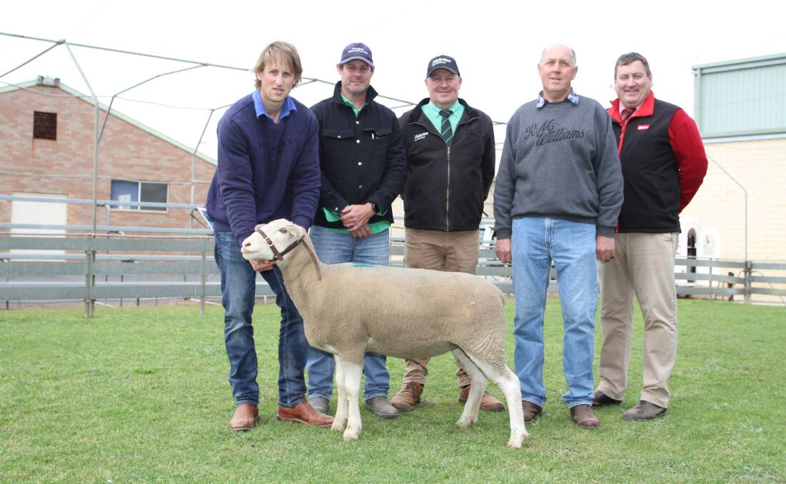 Buyers Josh Addis (left) and Jason Place, Kalagan White Suffolk stud, Denmark, Roy Addis, Nutrien Livestock Breeding, vendor Keith Ladyman, Kantara White Suffolk stud, Dumbleyung, with the $4000 top-priced White Suffolk ewe sold as part of Kantara's first stage stud dispersal at the sale and is believed to be a WA record top price for a White Suffolk ewe sold at auction.