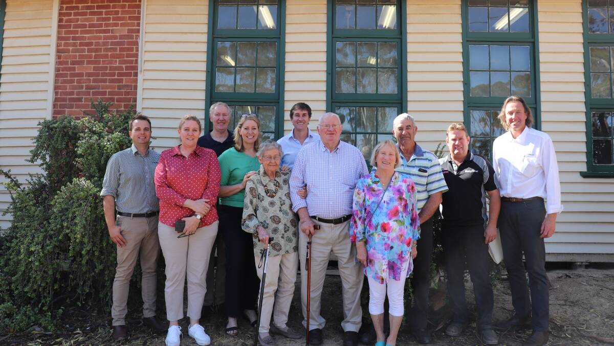  Landmark Harcourts rural real estate specialists and selling agents Simon Cheetham (left), Merredin and Rex Luers (far right), Kellerberrin, with vendors Mary-Kate, Justin, Geraldine, Margaret, Damian and Ted Capp and buyers Sandra, Geoff and Peter Waters.