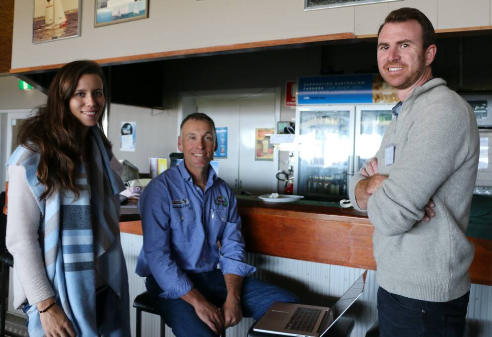 Siobhan Cowan (left) and Chad Hall (right), Arkle Farms, discussing the ASHEEP Fixed Time AI project with Enoch Bergman (middle), Swans Veterinary Services.