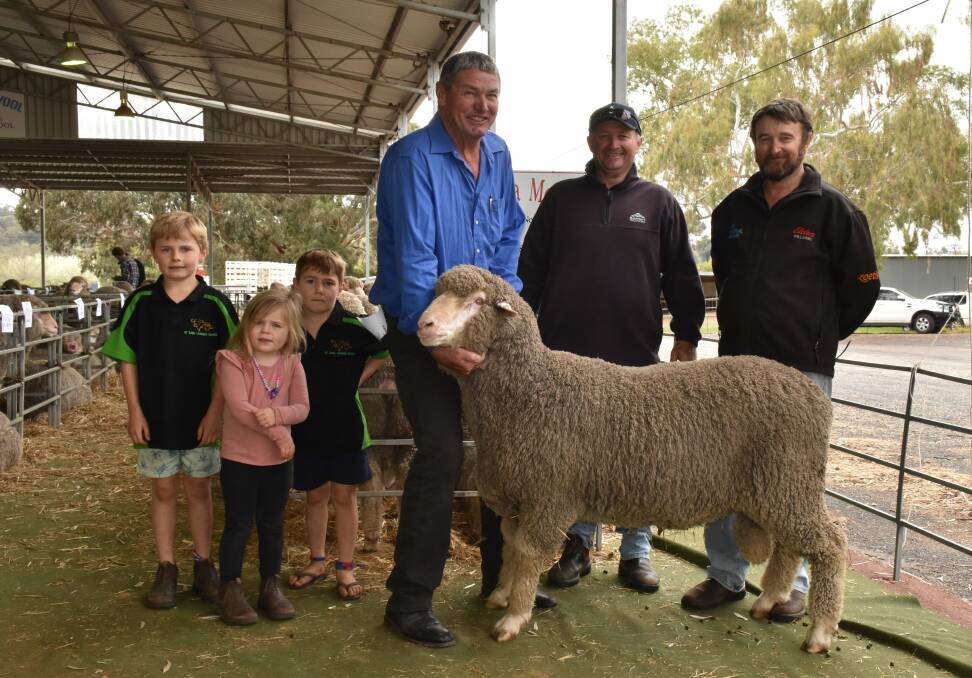 Jack (left), Charlotte and Archie Higham with their grandfather Andrew Higham, Barooga stud, Williams, holding the stud's $1800 top price ram with buyers Michael and Colin Gillett, Williams.