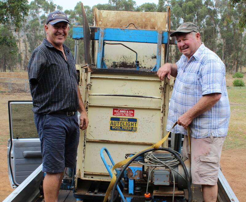 After arriving a few minutes prior to the wool press being auctioned Jeremy Taylor (left), Capel and Bill Willcocks, Capel, ensured their trip was worthwhile and bid up to $5200 to secure it.