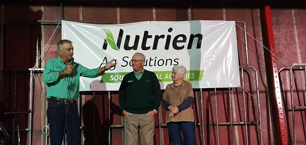 Nutrien Livestock State manager Leon Giglia (left) making a presentation to Neil Brindley and his wife Maureen at Mr Brindleys retirement function in December in Esperance.