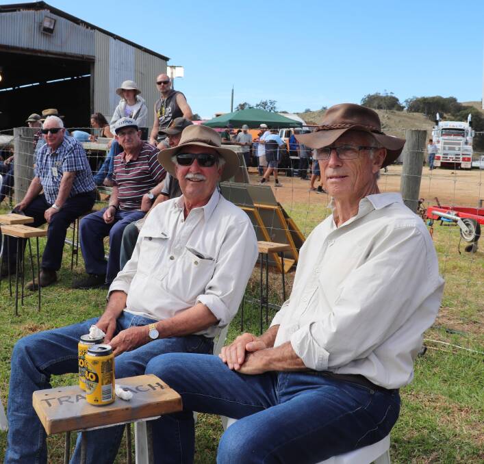 Watching the tractors ploughing up the paddock during a lunch break at Brunswick were Bill White (left), Wagin and John Dudley from North Dandalup.