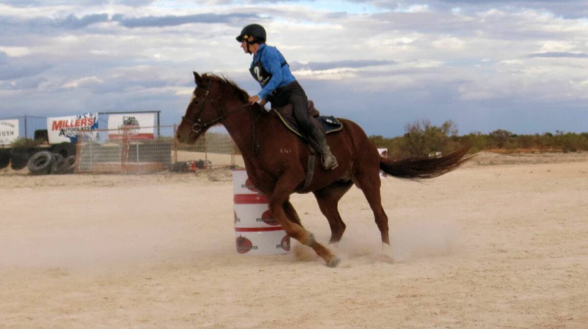  Lottie James competing on her horse, Aussie, in the Nullarbor Muster's barrel event. Photo by Layla Bowkett.
