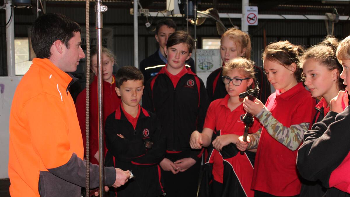 Year 11 student George Rowe (left), talks about shearing equipment to students from Mt Barker Community College at last weeks open day.