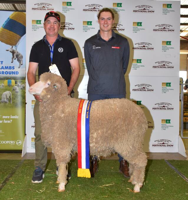 With the champion autumn shorn Merino ewe under 1.5 years exhibited by the Quailerup West stud, Wickepin, was stud co-principal Grantly Mullan (left) and judge Jake Michael, Balaclava, South Australia.