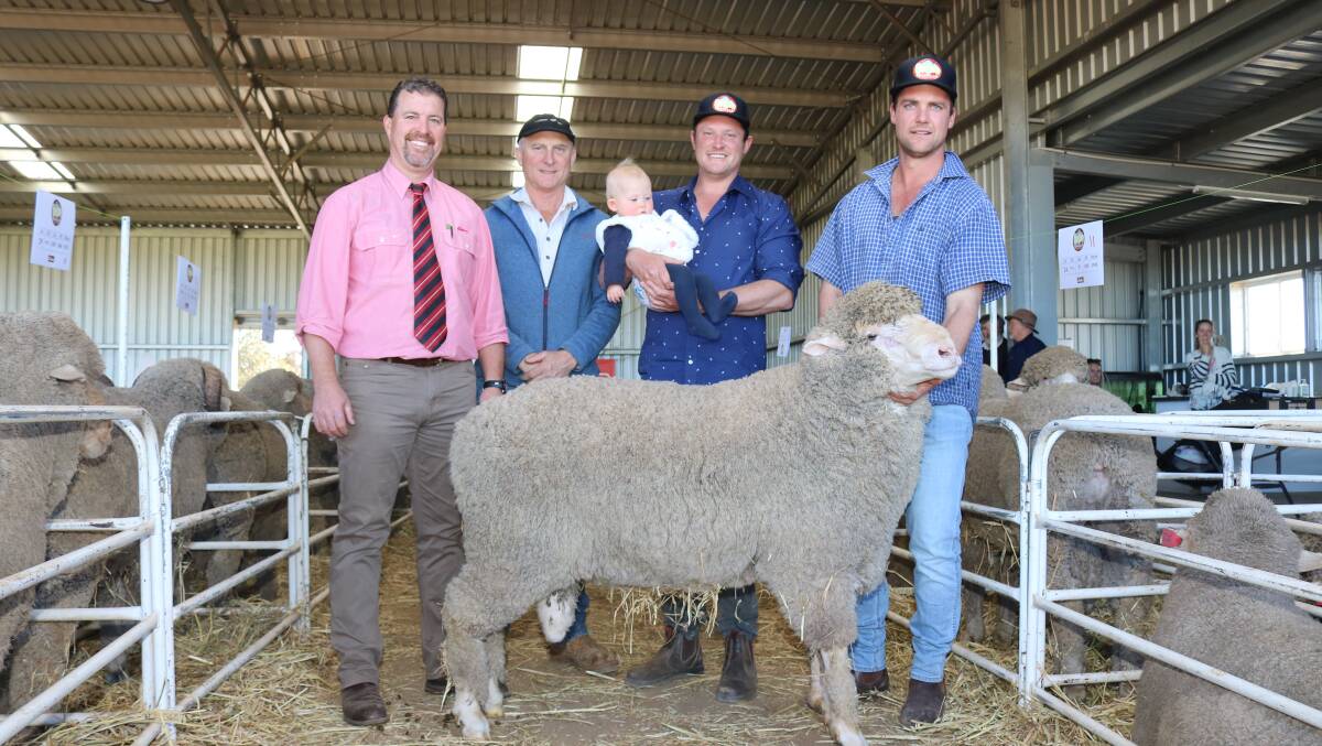 With the $3700 sale top-priced ram sold at the annual Mianelup stud sale were Elders auctioneer Nathan King (left), buyer Peter Morrell, Tatchbrook Farms, Arthur River, Mianelup stud principal Elliot Richardson holding eleven-month-old Celeste with Josh Leppens, Mianelup stud, Gnowangerup.