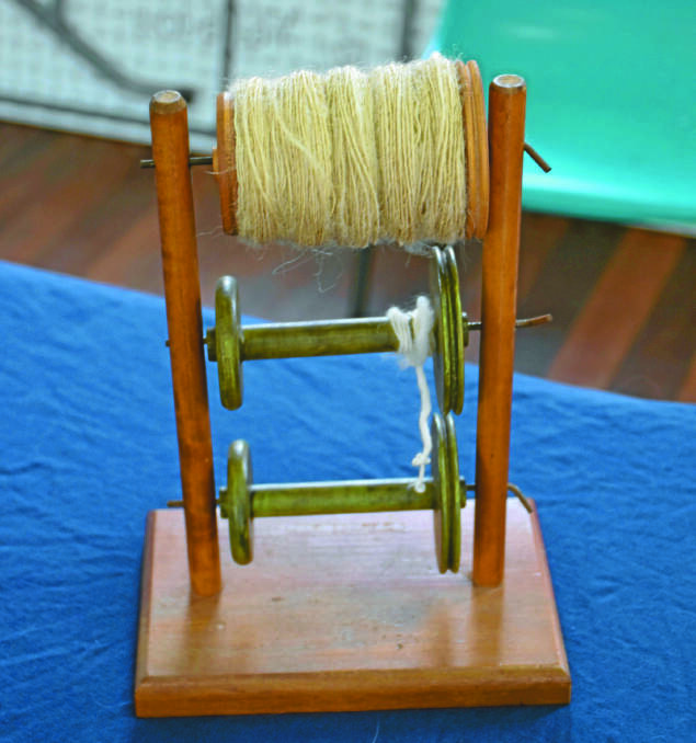 In spinning, a lazy kate is used to hold one or more bobbins in place while the yarn on them is wound off from the side of the bobbin.