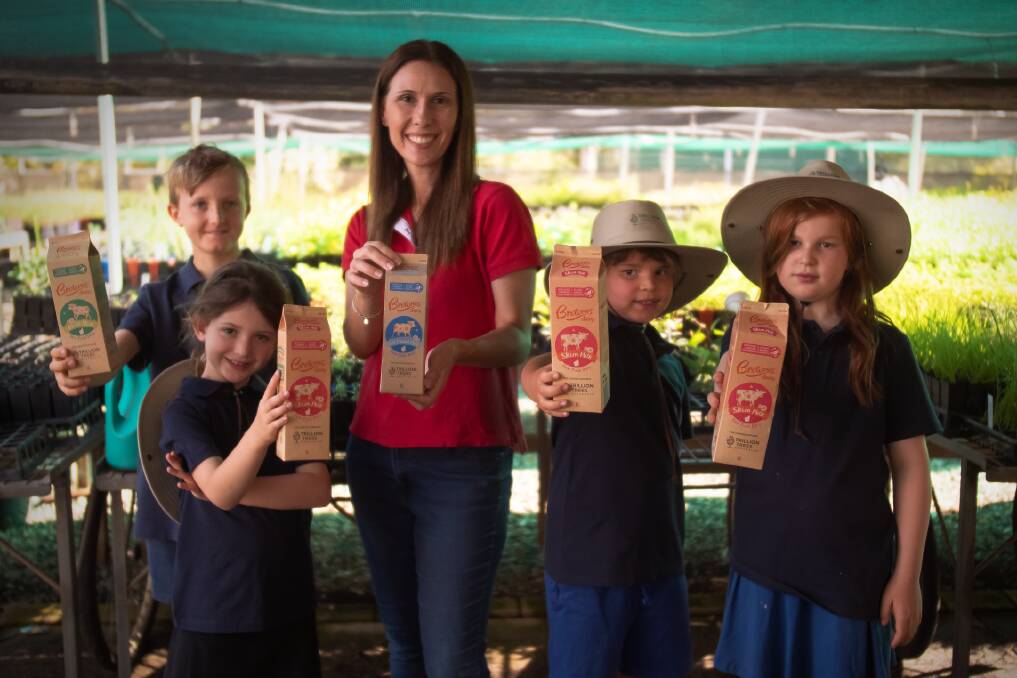 Brownes Dairy chief executive officer Natalie Sarich-Dayton road tests the new cartons with children.