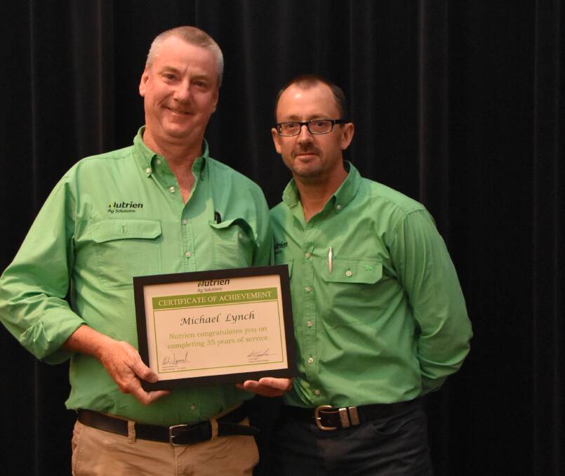 Nutrien Livestock Ravensthorpe and Hopetoun agent Gary McMeikan (left) was congratulated on 20 years service by Nutrien Ag Solutions western region manager Andrew Duperouzel.