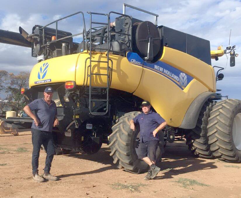 Ed Bride (left), McIntosh & Son, Katanning, checks in with local farmer Chris Anderson after the family recently completed another harvest with the Integrated Harrington Seed Destructor (iHSD) installed on their New Holland CR9090 harvester. The Andersons are looking forward to improved weed control and appreciate avoiding windrow and paddock burning.